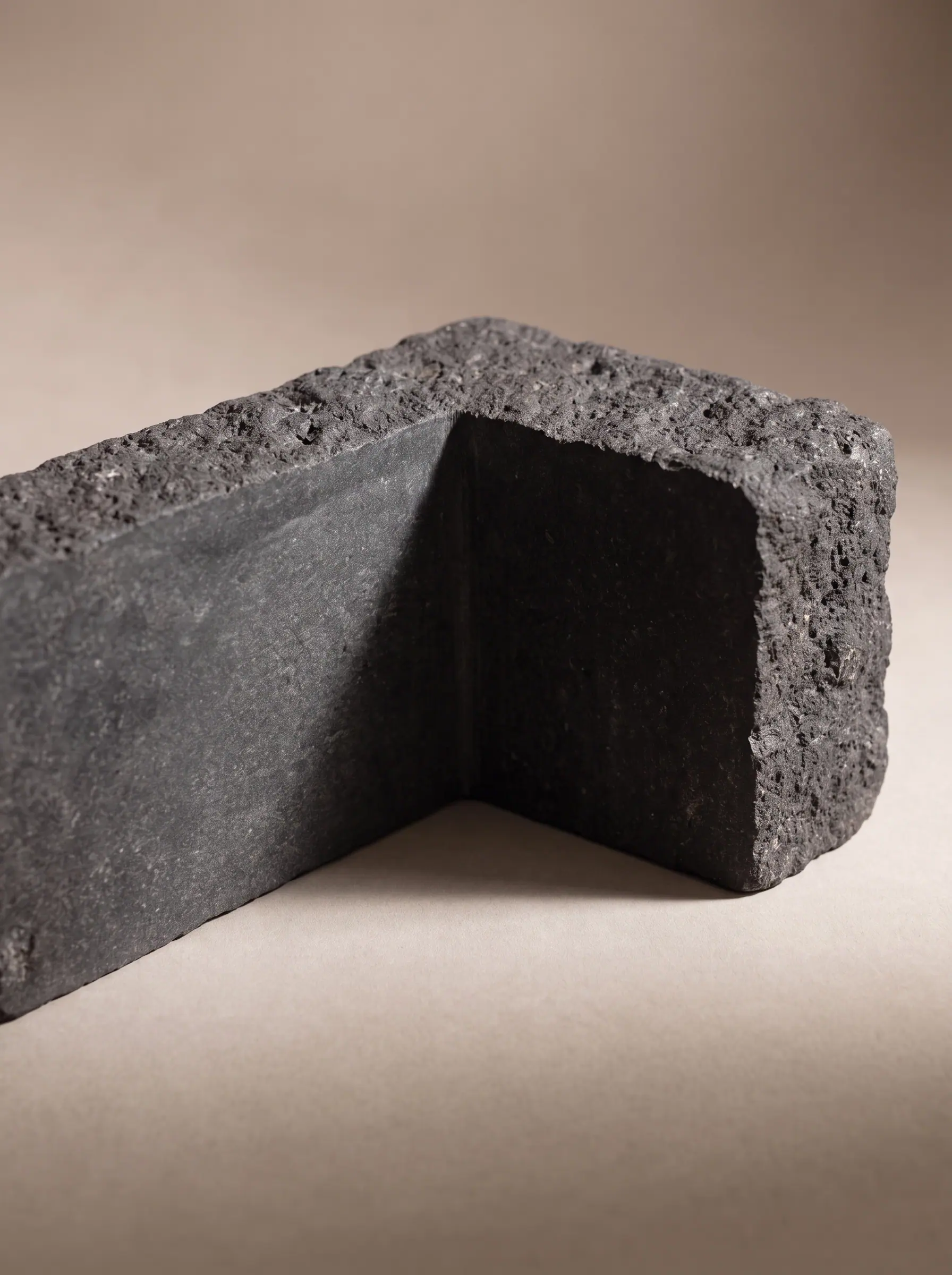 A rough basalt block with square cut-outs, corner detail